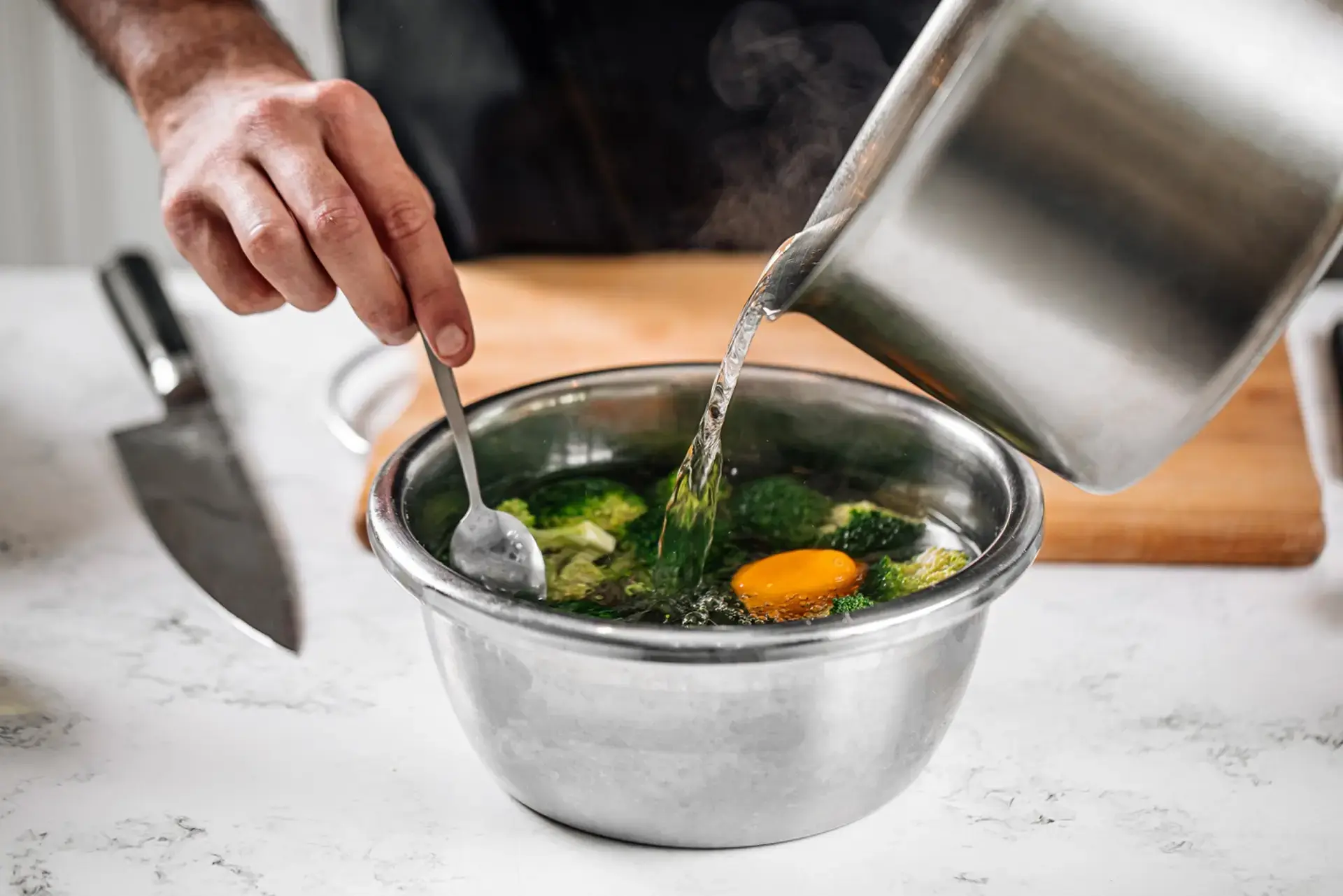 Chef blanching broccoli